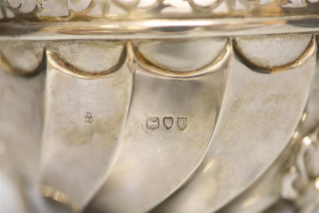 A late Victorian silver bowl, with pierced border of tripod feet, Wakely & Wheeler, London, 1895, diameter 15.7cm, 11.5oz.